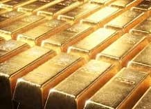 Precio de la onza del oro se encamina a cerrar la semana al alza tras el giro de la Fed sobre tasas de interés